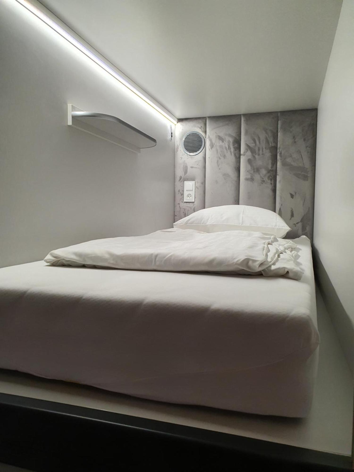 Single Capsule in a room with other capsules,1516075852:JPEG